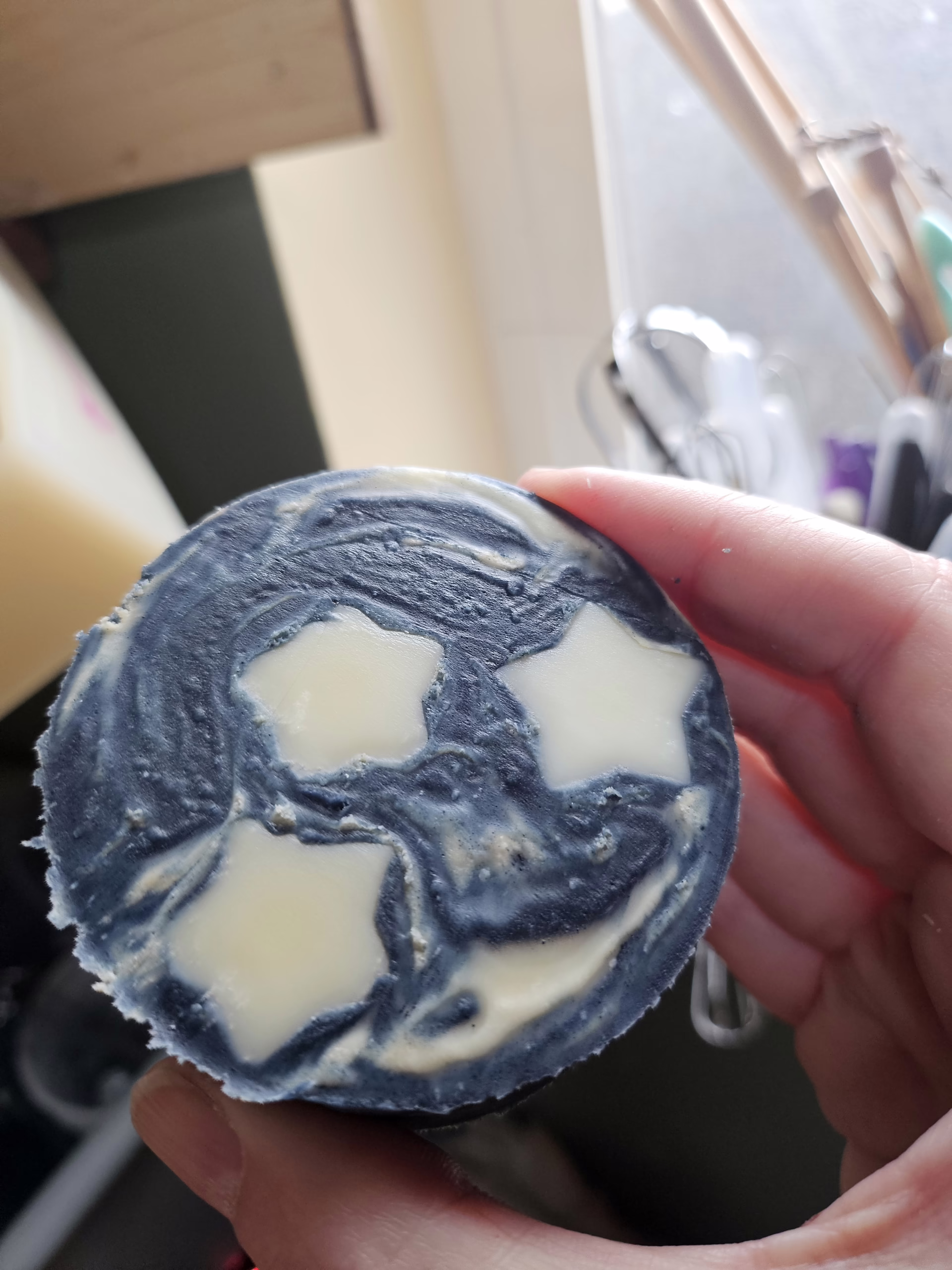 Dark blue indigo dyed soap with 3 stars representing the 3 of pentacles